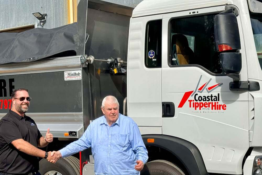 Coastal Tipper Hire manager Brett Cook with City Fleet CEO Wade Moran with one of the Sitrak TG5 trucks